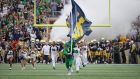 Notre Dame’s Leprechaun mascot leads out the team ahead of a game against the Ball State Cardinals in 2018. Photograph: Jonathan Daniel/Getty
