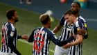 West Brom celebrate after Dara O’Shea doubled their lead against Derby. Photograph: David Rogers/Getty