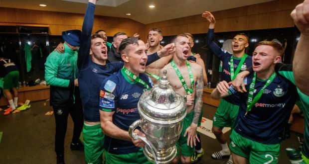 Shamrock Rovers celebrate with the trophy in the dressing room after winning the FAI Cup last year. Photo: Ryan Byrne/Inpho