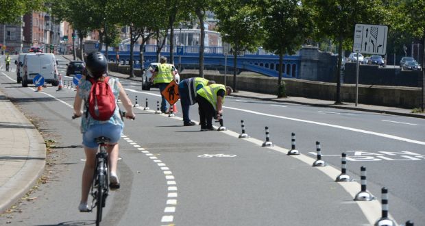  Members of Dublin City Council installing new cycle lane designation along Wolf Tone Quay last month.Photograph: Alan Betson 