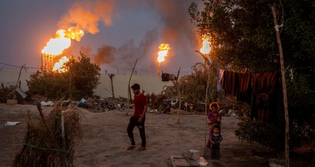 Flares from oil wells light the night sky in Nahran Omar in Iraq. Photograph: Ivor Prickett/New York Times 