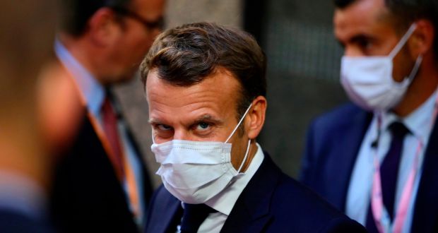 French President Emmanuel Macron, center, leaves the European Council building early on Monday during an EU summit in Brussels. Photograph: Getty Images