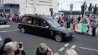 People line the streets as the funeral cortege of Jack Charlton passes through his hometown of Ashington in Northumberland. Photo: Owen Humphreys/PA Wire