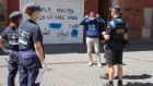  Police officers asking  a man to wear a  face mask in Lleida, Catalonia. Regional authorities announced special movement restrictions  in the area of Segria in Lleida due to a coronavirus outbreak. Photograph: EPA/Ramon Gabriel