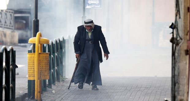 An elderly Palestinian man during clashes in the West Bank city of Hebron. Photograph: Abed al Hashlamoun/EPA