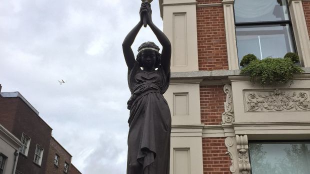 One of the statues depicting slave girls holding torches.          Photograph: Wikimedia Commons