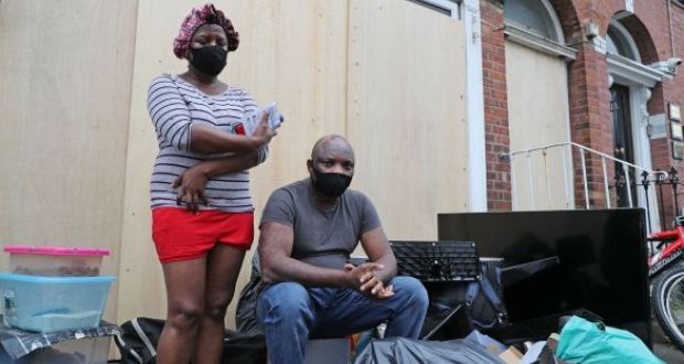 Theresa Chimamkpam and Elias Jegede with their belongings after being evicted from Berkeley Road, Dublin, on Wednesday. Photograph: Nick Bradshaw