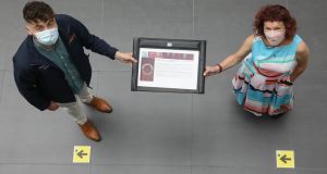 Professor Michelle Millar and president of NUI Galway’s  students’ union Pádraic Toomey display the university’s new “community promise”. Photograph: Aengus McMahon.