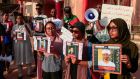 Sudanese protesters hold images of missing people during a rally in the capital, Khartoum, last year. Photograph: Ebrahim Hamid/AFP via Getty