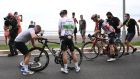  Ireland’s Sam Bennett is helped by staff members after a crash during the first stage of the Tour de France on Saturday. Photograph: Getty Images