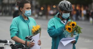 Deliveroo riders and cyclists hold a vigil on O’Connell Street in Dublin for Thiago Cortes (28). Photograph: Niall Carson/PA Wire