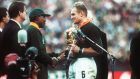 South African president Nelson Mandela presents the William Webb Ellis trophy to captain Francois Pienaar after the victory over New Zealand in the 1995 Rugby World Cup Final at Ellis Park in Johannesburg. Photograph:  Billy Stickland/Inpho