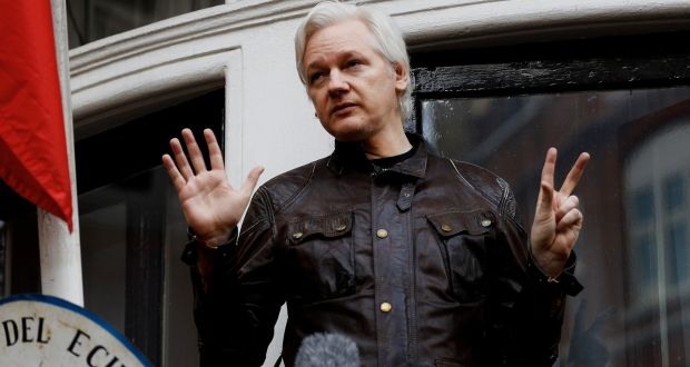 Julian Assange on the balcony of the Ecuadorian embassy in London, May 2017. Photograph: Peter Nicholls/File Photo/Reuters