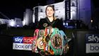 Katie Taylor shows off all her belts  after winning the undisputed lightweight title contest against Delfine Persoon at  Matchroom Fight Camp in Essex. Photograph: Mark Robinson/Inpho/Matchroom Boxing