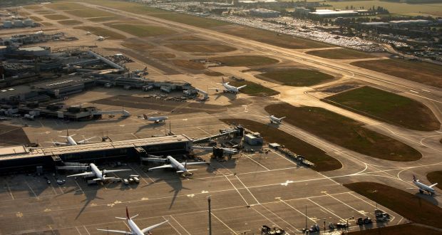 Aircrafts taxi along the perimeter of the north runway at London Heathrow Airport.