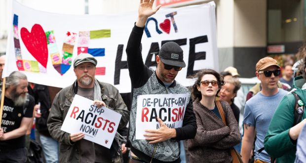Anti-racism campaigners taking part in a rally last year outside Google  headquarters on Barrow Street in Dublin. Photograph: Tom Honan/The Irish Times