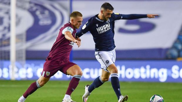 Josh Benson of Burnley battles for possession with Troy Parrott of Millwall during the Carabao Cup third-round match at The Den. Photograph: Ben Stansall - Pool/Getty Images