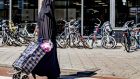 A woman wearing a Niqab Islamic dress, in Rotterdam. The Dutch ban applies  in public places such as schools, hospitals, government offices, and on public transport, though not on the street. Photograph: Robin Utrecht/AFP/Getty    Images