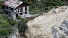 Flood waters surging through Saint-Martin-Vesubie, southeastern France, after heavy rains and floodings hit the Alpes-Maritimes department. Photograph: Valery Hache/AFP via Getty