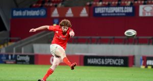 Munster’s Ben Healy kicks the late  conversion to seal victory over Edinburgh at Thomond Park. Dan Sheridan/Inpho 