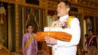  Thailand’s  King Maha Vajiralongkorn Bodindradebayavarangkun carries new saffron robes next to Queen Suthida  during a ceremony in Bangkok on Saturday. Photograph: EPA