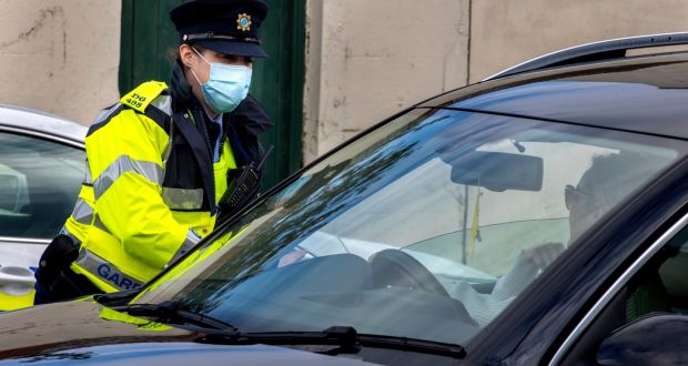 A garda at a checkpoint. By the end of 2021 the Garda force  is set to expand to 15,000 sworn members. Photograph: Liam McBurney/PA Wire