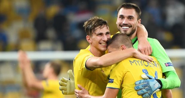 Ukraine’s goalkeeper Heorhii Bushchan celebrates with team-mates after the Uefa Nations win over  Spain at the Olympic Stadium in Kiev. Photograph: Sergei Supinsky/AFP via Getty Images