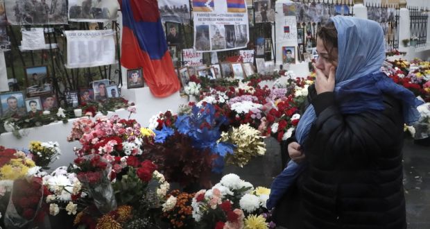 A woman grieves for victims of the military conflict in the self-proclaimed Nagorno-Karabakh Republic in front of the Armenian embassy in Moscow. Photograph: Maxim Shipenkov