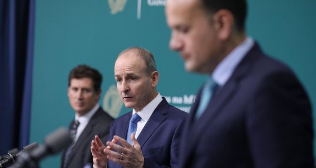Taoiseach Micheál Martin (centre) speaking at Government Buildings, with Minister for Climate Action Eamon Ryan and Tanaiste Leo Varadkar. Photograph:  Julien Behal/PA Wire