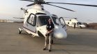 Helicopter pilot Dave McInerney gets ready to start work