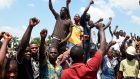 Protesters chant and sing solidarity songs as they barricade an expressway to protest against police brutality, at Magboro, Ogun state, Nigeria. Photograph: Pius Utomi Ekpei/AFP via Getty Images