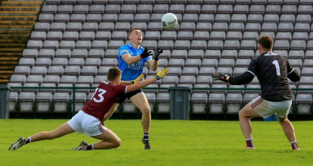 Con O’Callaghan fists a point for Dublin in their win over Galway. Photograph: Bryan Keane/Inpho