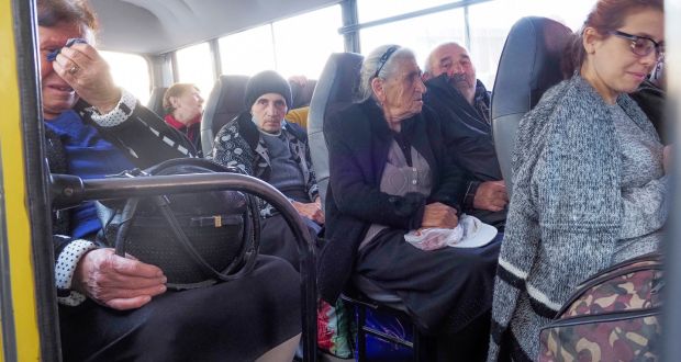 People sit in a bus as they prepare to leave Stepanakert, in the separatist region of Nagorno-Karabakh. Photograph: AP Photo