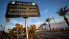 A street sign in Nice reads ‘Covid-19 respect containment’.  Fresh lockdowns announced across Europe in recent days to contain the resurgence of the coronavirus pandemic have triggered a flurry of downgrades to economic growth forecasts.   Photograph:  Arnold Jerocki/Getty Images
