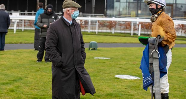 John Oxx talks to jockey Gavin Ryan at the Curragh on Monday, where he ran his final horses as a trainer. Photograph:  Morgan Treacy/Inpho