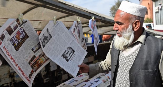 A man reads a local newspaper showing a photograph of newly elected US president Joe Biden, in Kabul, on Sunday. Photograph: Getty Images