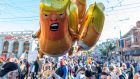 A person holds Donald Trump baby balloons in  San Francisco, California on Saturday. Photograph: Josh Edelson/AFP via Getty Images