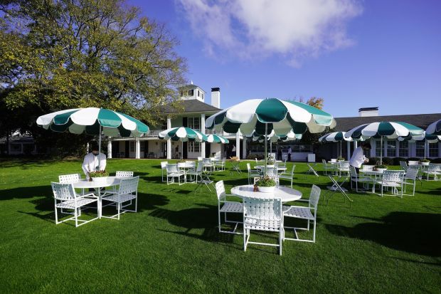 Picnic tables are set up outside the clubhouse. Photo: Tannen Maury/EPA