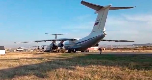 A handout image taken from video footage made available on Tuesday  by the press service of the Russian Defense Ministry shows Russian Il-76 military transport planes with Russian peacekeepers and equipment on board after landing at the Erebuni military airport outside Yerevan, Armenia. Russian peacekeepers arrive in Armenia to control the ceasefire and the halt of military operations in the Nagorno-Karabakh conflict zone. Photograph:  EPA/Russian Defence Ministry