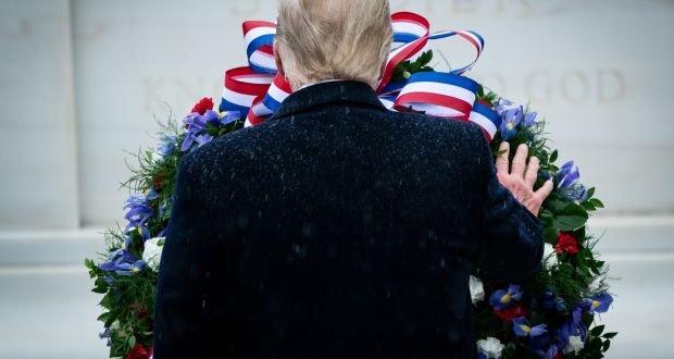 President Donald Trump participates in a wreath laying at the Tomb of the Unknown Soldier during a National Veterans Day Observance ceremony at Arlington National Cemetery in Arlington, Va. Photograph: Erin Schaff/The New York Times