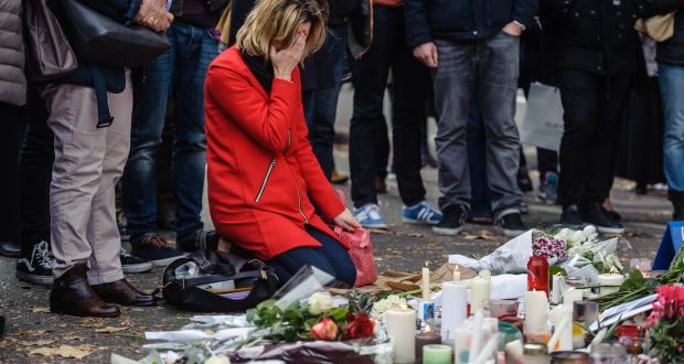  People lay flowers and candles in front of an impromptu memorial for the victims of the  November 13th terrorist attacks set up near the Bataclan concert venue in Paris, in November 2015. File photograph: Christophe Petit Tesson/EPA