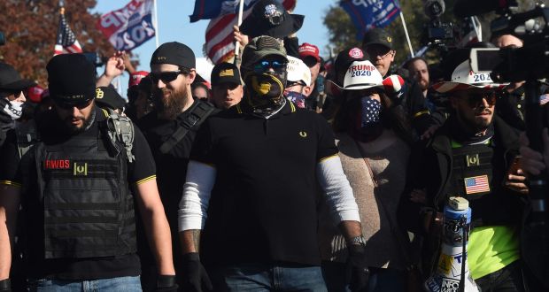 Members of "The Proud Boys" join supporters of US President Donald Trump during a rally in Washington, DC, on November 14, 2020. - Supporters are backing Trump's claim that the November 3 election was fraudulent. (Photo by Olivier DOULIERY / AFP) (Photo by OLIVIER DOULIERY/AFP via Getty Images)