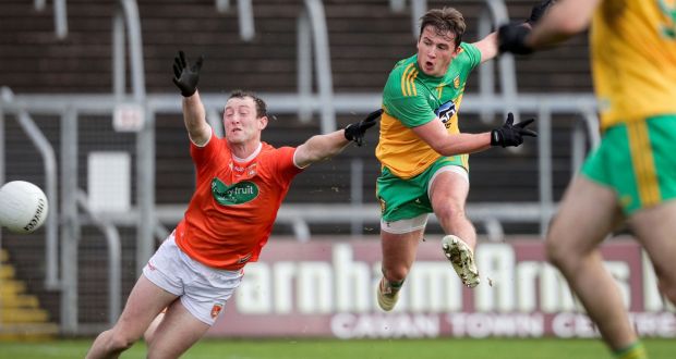 Donegal’s Peadar Mogan scores a goal despite the efforts of Armagh’s Ryan Kennedy of Armagh in the Ulster semi-final at Kingspan Breffni Park. Photograph: Inpho