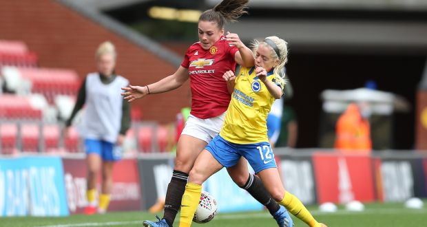 Kirsty Hanson of Manchester United is tackled by Denise O’Sullivan of Brighton. Photo: Charlotte Tattersall/Getty Images