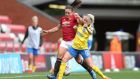 Kirsty Hanson of Manchester United is tackled by Denise O’Sullivan of Brighton. Photo: Charlotte Tattersall/Getty Images