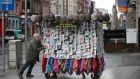 A Mask Vendor getting ready to trade on Dublin’s O’Connell Street. Photograph: Nick Bradshaw/The Irish Times.