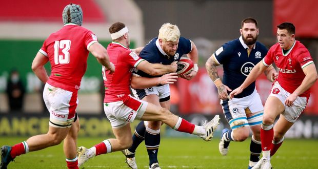 Scotland’s Oli Kebble is tackled by Gareth Davies of Wales.  Kebble gets a first start as he links up with hooker Fraser Brown and Simon Berghan for the game against France. Photograph: Tommy Dickson/Inpho 