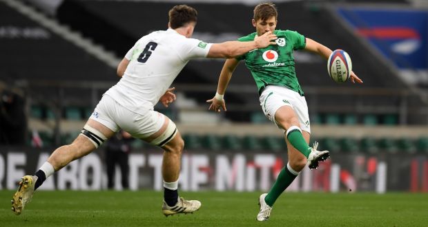 Ireland outhalf Ross Byrne  puts in a cross kick under pressure from England’s  Tom Curry  during the  Autumn Nations Cup match  at Twickenham. Photograph: Mike Hewitt/Getty Images
