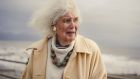 The acclaimed author and historian Jan Morris visits the coast on a windy day in Criccieth, Wales, March 13, 2018. Photograph: Tom Jamieson/The New York Times