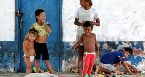 Research  showed that Ireland’s extremely generous tax breaks afforded to companies onshoring intellectual property is starting to impact on African and Latin American countries. Photo: Children playing in remote village of El Yaque, Margaritta Island, Venezuela. 